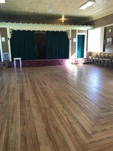 Photo of the interior view facing the stage of the Rydal Bank Community Hall